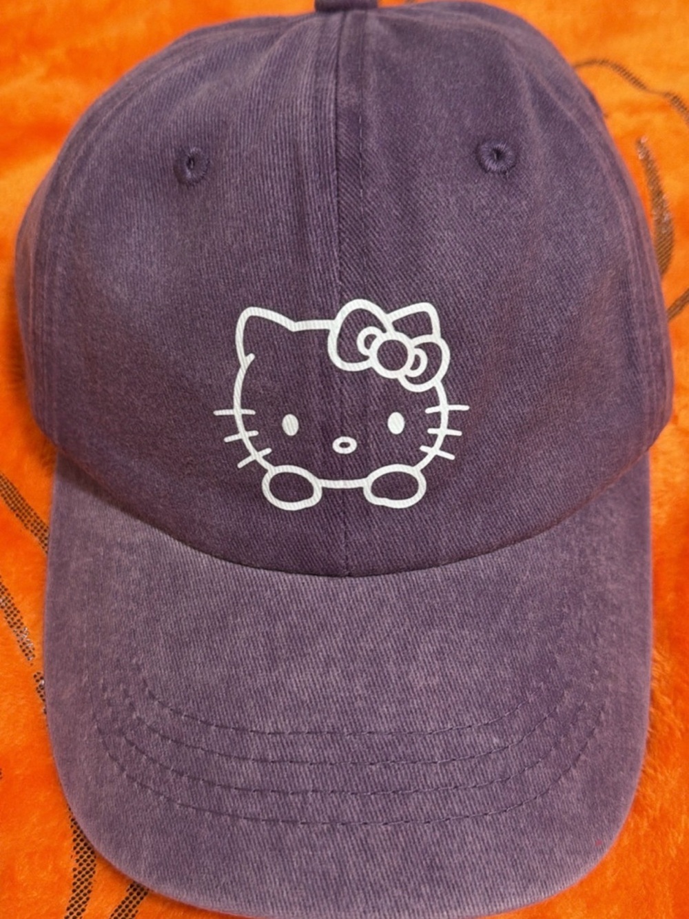 Hello Kitty purple hat.